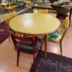 Finish shows use but is not worn. Legs show more wear. 1550 Round table in original Wheat.