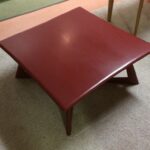 M392 Cocktail table refinished in red lacquer
