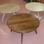 Two are Curly Maple, the dark table is Mirado, a Brazilian Rosewood. Revolving cocktail tables in a natural finish.