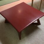 M392 Cocktail table refinished in red lacquer M392