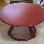 Revolving cocktail table in red lacquer $425. 32" round. Made from 1941 to 44