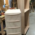 Three drawer filing cabinet in the raw