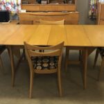 full opened with both leaves with four cat eye chairs newly upholstered. All in excellent condition  Table and chairs 1549 Harmonic dining table