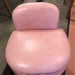original vinyl upholstery and legs refinished in Champagne.
 l Niagara vanity seat