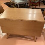 Table is in excellent original champagne. 42 x 26 leaves down