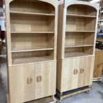arched tops and cabinet below with adjustable shelves