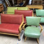 ...and two pull-up chairs. Vinyl on Davenport and love seats is in very good/excellent condition. The wood needs to be redone. One loveseat has been refinished.