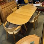 two 12" leaves. Table comes with pads.